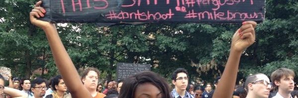 RT @keithboykin: Woman holding sign at #MikeBrown…